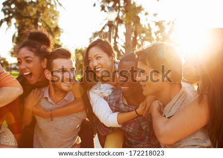 Group Of Friends Having Fun Together Outdoors