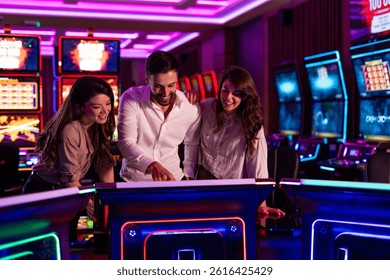 A group of friends having fun while playing games at a neon-lit casino. The vibrant atmosphere enhances the entertaining experience as they engage in friendly gaming activities.