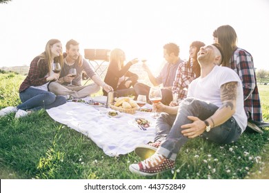 Group Of Friends Having Fun While Eating And Drinking At A Pic-nic - Happy People At Bbq Party