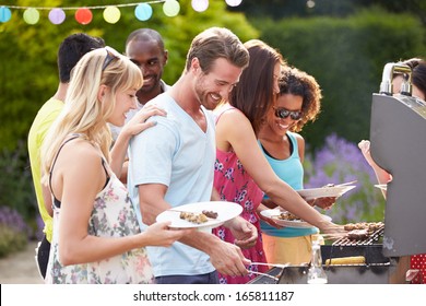 Group Of Friends Having Outdoor Barbeque At Home - Powered by Shutterstock