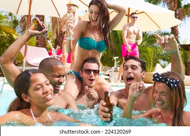 Group Of Friends Having Party In Pool Drinking Champagne - Powered by Shutterstock