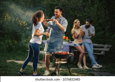 Group Of Friends Having Picnic In The Park