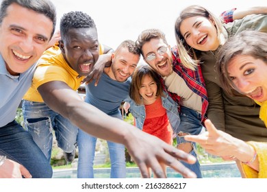 Group Of Friends Looking Camera While Joking In Big Villa With Pool An Garden -  Funny People Mixed Age Range Enjoy In The Vacation