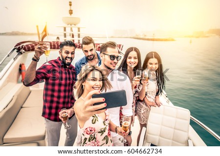 Group of friends making party on a yacht in Dubai - Happy people having a fancy party on a luxury boat