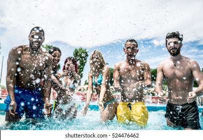 Group Of Friends Making Party In The Pool