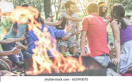 Group Of Friends Making Picnic With Barbecue On City Park Outdoor - Young People Eating Bbq Meal And Drinking Wine At Dinner In Backyard - Focus On Behind Right Guys - Youth Concept - Vintage Filter