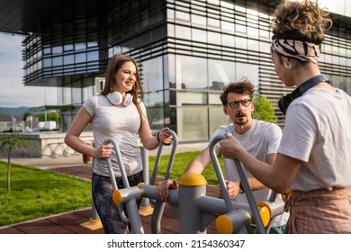 Group Of Friends Man And Women Male And Young Adult People Training At Outdoor Open Gym In Park In Front Of Modern Building Real People Sport And Recreation Exercise Healthy Lifestyle Concept