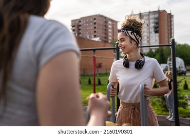 Group Of Friends Man And Women Male And Young Adult People Training At Outdoor Open Gym In Park In Front Of Modern Building Real People Sport And Recreation Exercise Healthy Lifestyle Concept