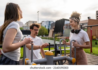 Group Of Friends Man And Women Male And Young Adult People Training At Outdoor Open Gym In Park In Front Of Modern Building Real People Sport And Recreation Exercise Healthy Lifestyle Concept