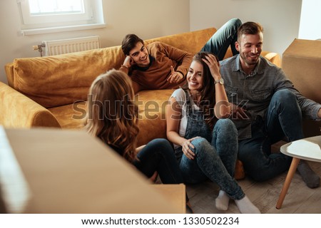 Group of friends moving into her new home Stock photo © 
