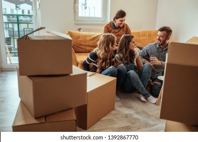 Group Of Friends Moving Into New Apartment