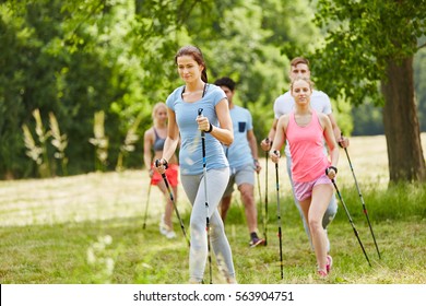 Group Of Friends Nordic Walking For Leisure 