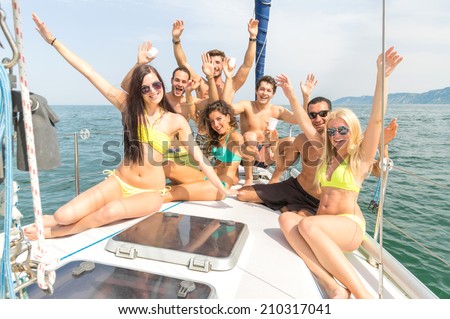 Group of friends on a boat having fun