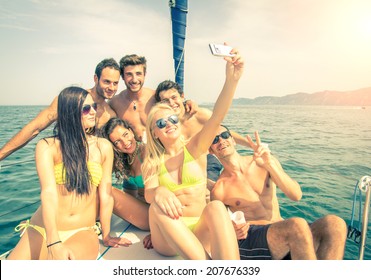 Group of friends on a boat taking a selfie