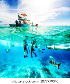 Group Of Friends On A Carribean Sea Adventure With Party Boat, Snorkeling And Scuba Diving