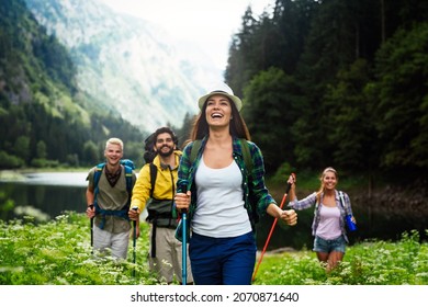 Group of friends on a hiking, camping trip in the mountains - Powered by Shutterstock