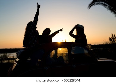 Group Of Friends On A Roadtrip Through Countryside