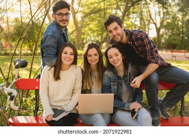 Group Of Friends In The Park Having Fun Together