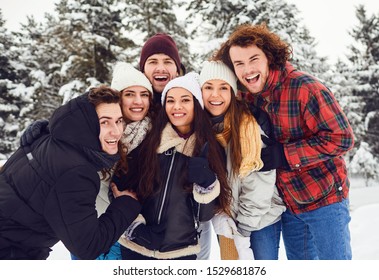 Group Of Friends In The Park In Winter