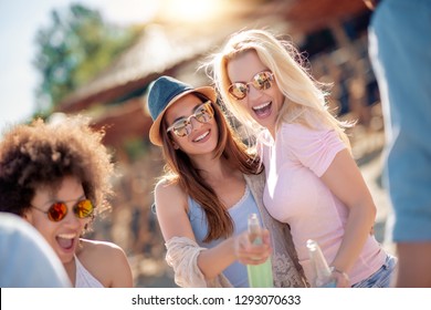 Group Of Friends Partying On The Beach.Young People Celebrating During Summer Vacation.