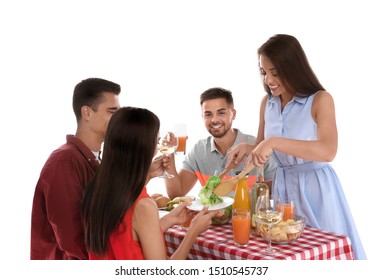 Group Of Friends At Picnic Table Against White Background