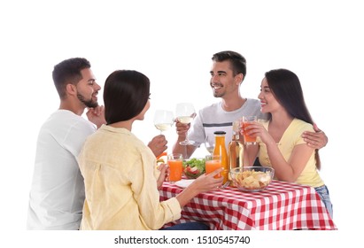 Group Of Friends At Picnic Table Against White Background