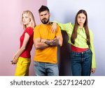 Group of friends posing in studio. Group of tree People. Friends face. Three young people portrait. Great team. Group of three cheerful young people in casual wear looking at camera.