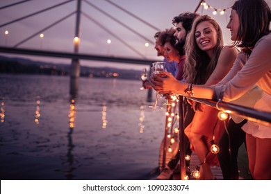 Group of friends relaxing on a boat cruise - Powered by Shutterstock