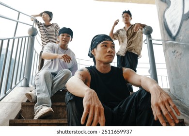 Group of Friends Relaxing on Outdoor Staircase - Powered by Shutterstock