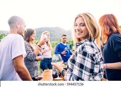 Group of friends at restaurant outdoors - People having dinner in a home garden - Powered by Shutterstock