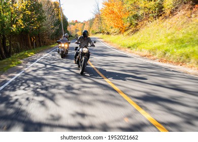 Group of friends riding motorcycles in the fall in Canada - Shutterstock ID 1952021662
