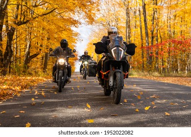Group of friends riding motorcycles in the fall in Canada