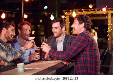 Group of friends at rooftop party - Powered by Shutterstock