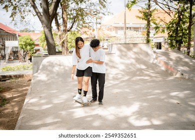 A group of friends are sharing a joyful moment at the skatepark on a bright sunny day - Powered by Shutterstock