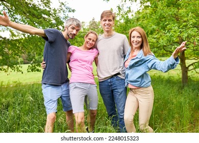 Group of friends or siblings have fun on a trip in nature on summer vacation - Shutterstock ID 2248015323