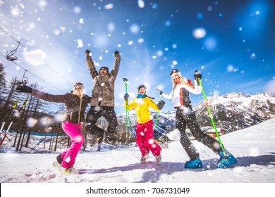 Group Of Friends With Ski On Winter Holidays - Skiers Having Fun On The Snow