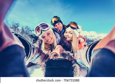 Group Of Friends With Ski On Winter Holidays - Skiers Having Fun On The Snow