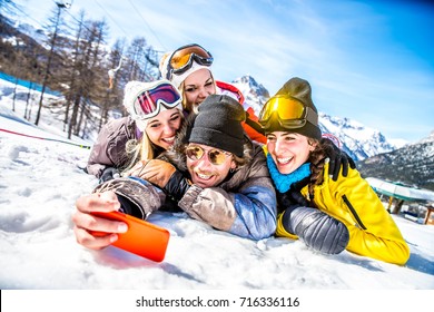 Group Of Friends With Ski On Winter Holidays - Skiers Having Fun On The Snow