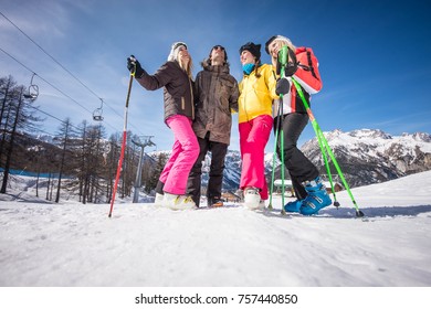 Group Of Friends With Ski On Winter Holidays - Skiers Having Fun On The Snow