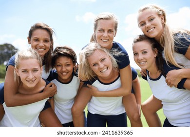 Group, friends and smile on field with piggyback for fitness, sport and exercise with collaboration. Teamwork, unity or women and portrait, happy or blue sky outdoor in nature for workout or training