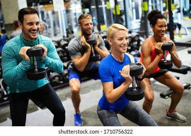 Group of friends smiling and enjoy sport in gym - Powered by Shutterstock