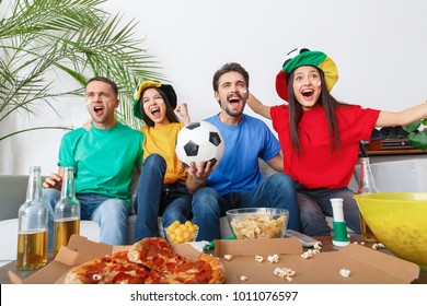 Group Of Friends Sport Fans Watching Match In Colorful Shirts Victory Congratulations