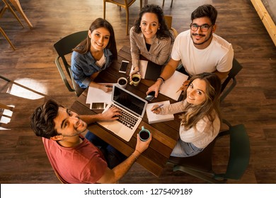 Group of friends studying together for finals
