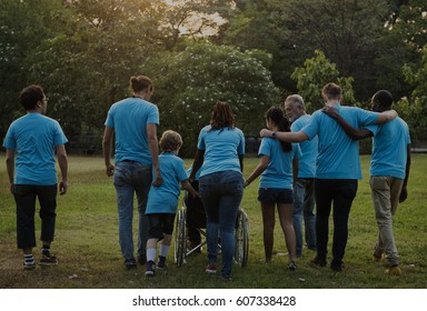 Group Of Friends Support And Walking Together In Rear View