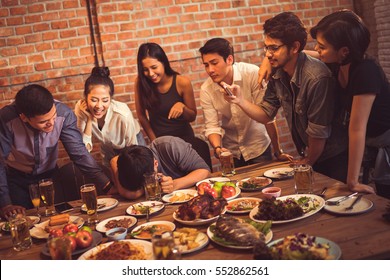Group of friends taking pictures people who are intoxicated from drinking the Asians. - Shutterstock ID 552862561