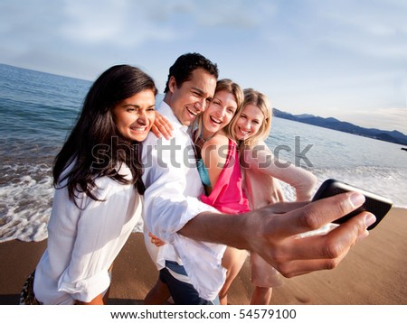 A group of friends taking a self portrait with a camera phone