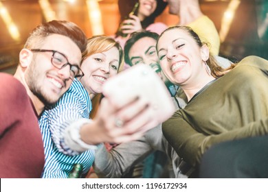 Group Of Friends Taking Selfie In Underground Metropolitan Station Escalator - Young People Using Instant Camera At Party Night  - Friendship And Technology Trends Concept - Focus On Left Girl Face