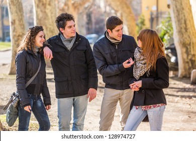 Group Of Friends Talking Outside