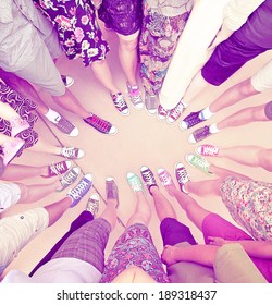 A Group Of Friends With Their Legs In A Complete Circle Done With A Retro Vintage Instagram Filter 