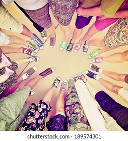 A Group Of Friends With Their Legs In A Complete Circle